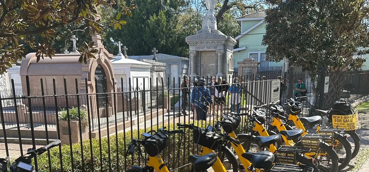 Guided pedal bike tour visiting cemetery in New Orleans